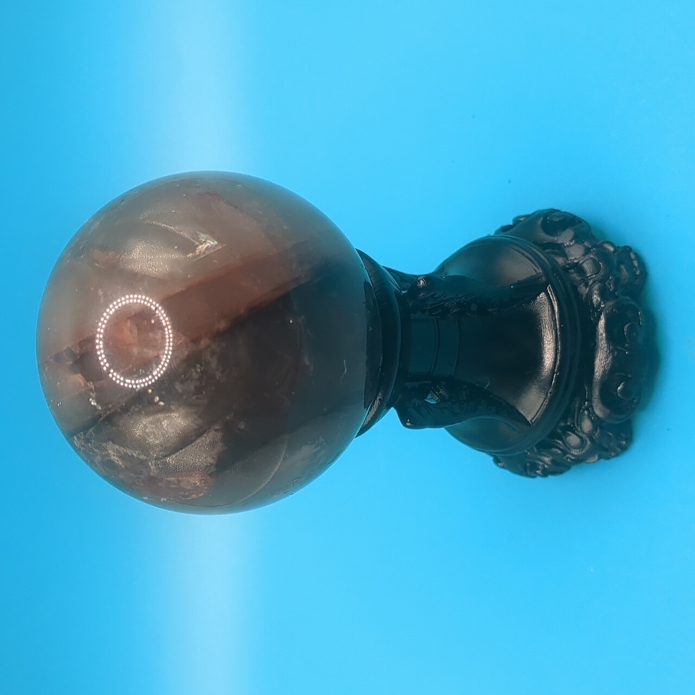 Small flashy fire quartz sphere with stand